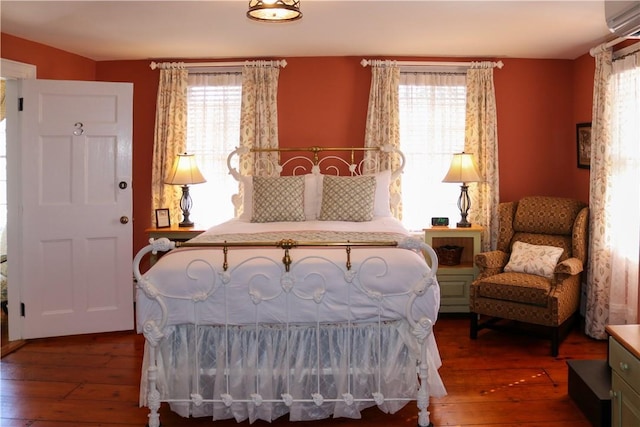 763 Old State Route 22, Dover Plains, NY 12522 - bedroom featuring hardwood / wood-style flooring, multiple windows, and an AC wall unit