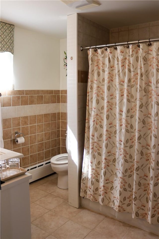 763 Old State Route 22, Dover Plains, NY 12522 - full bathroom featuring tile walls, a baseboard heating unit, toilet, tile patterned flooring, and shower / bath combo with shower curtain