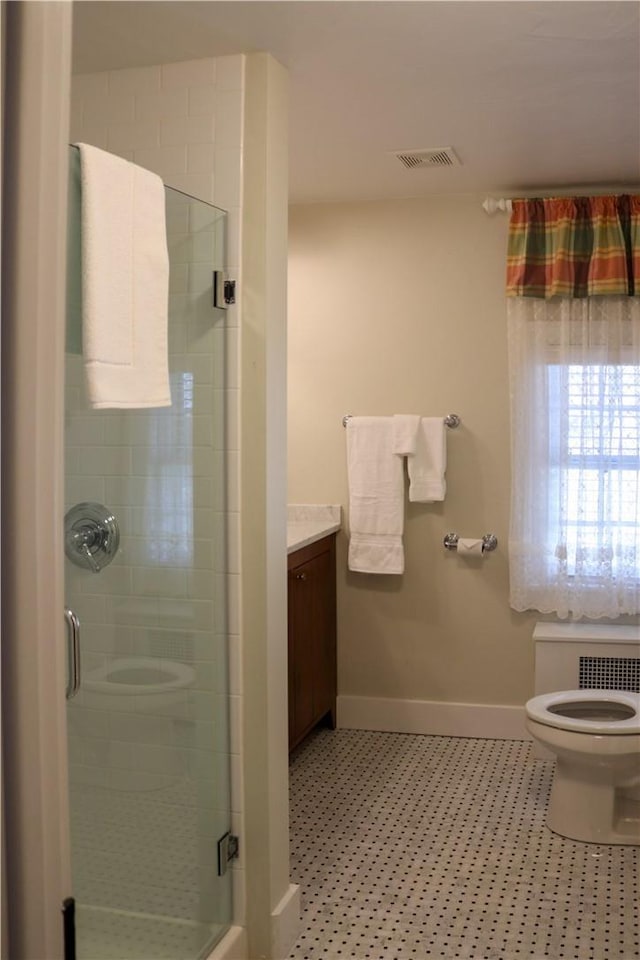 763 Old State Route 22, Dover Plains, NY 12522 - bathroom with toilet, baseboards, radiator heating unit, vanity, and a stall shower