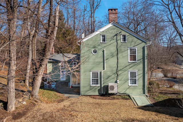 763 Old State Route 22, Dover Plains, NY 12522 - rear view of property with a chimney and ac unit
