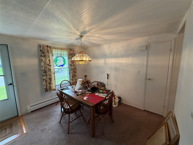 305 Brittany Ter Unit 305, Rock Tavern, NY 12575 - dining room featuring a baseboard heating unit, a chandelier, a textured ceiling, and carpet