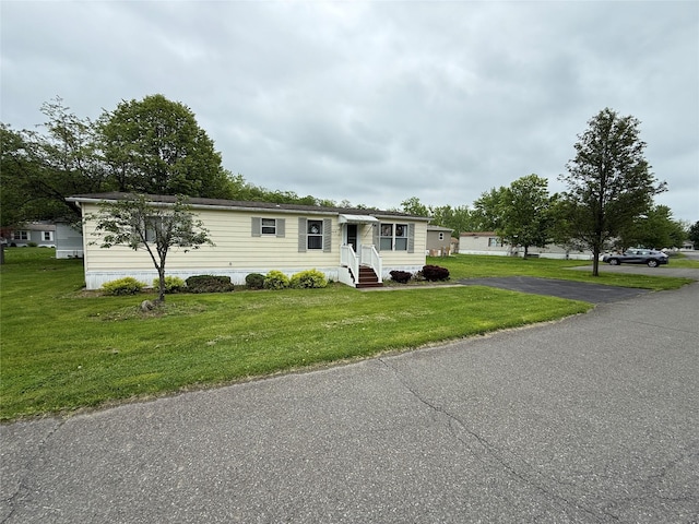 305 Brittany Ter Unit 305, Rock Tavern, NY 12575 - manufactured / mobile home featuring driveway, a front yard, and entry steps