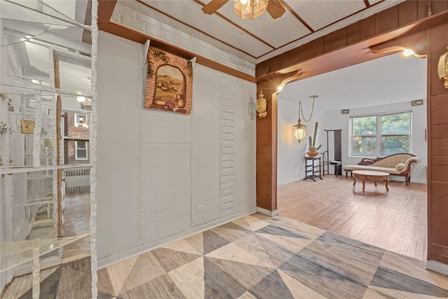 39-20 52nd St Unit 2G, Woodside, NY 11377 - hallway featuring radiator and wood finished floors
