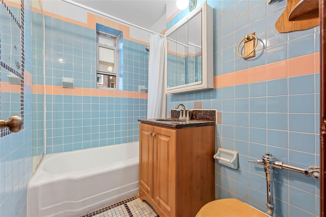 39-20 52nd St Unit 2G, Woodside, NY 11377 - full bath with tile walls, tile patterned floors, shower / tub combo, vanity, and toilet