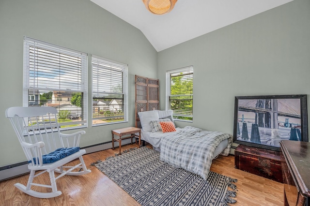 56 15th St, West Babylon, NY 11704 - sitting room featuring lofted ceiling, wood finished floors, and baseboard heating