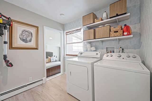 56 15th St, West Babylon, NY 11704 - laundry room featuring a baseboard heating unit, washing machine and clothes dryer, and light wood-style floors