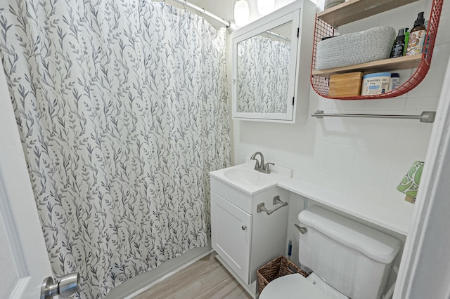 56 15th St, West Babylon, NY 11704 - full bath featuring toilet, vanity, curtained shower, and wood finished floors