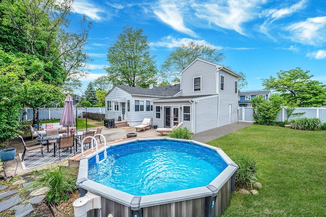 56 15th St, West Babylon, NY 11704 - rear view of property with a hot tub, a patio, and entry steps