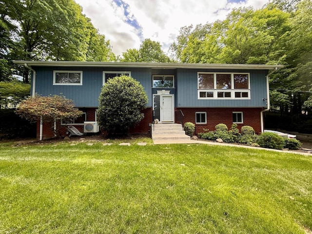 73 Wilder Rd, Suffern, NY 10901 - raised ranch featuring entry steps, a front yard, and brick siding