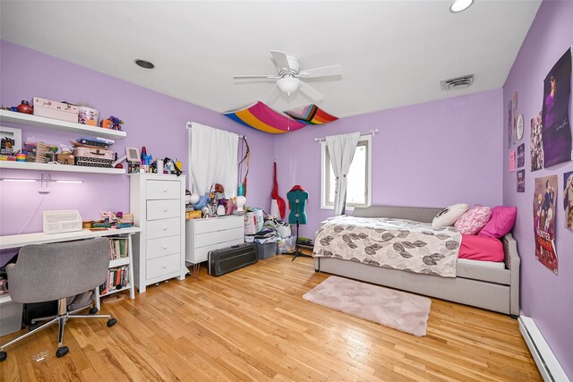 1608 Union Ave Unit 1608, Hewlett, NY 11557 - bedroom with baseboard heating, wood finished floors, an office area, recessed lighting, and a ceiling fan