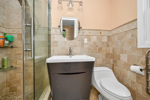 1608 Union Ave Unit 1608, Hewlett, NY 11557 - bathroom with a stall shower, tile walls, vanity, toilet, and a wainscoted wall