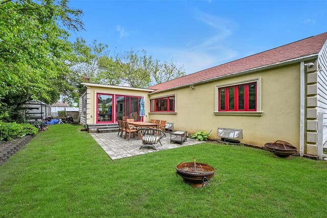 1608 Union Ave Unit 1608, Hewlett, NY 11557 - back of house featuring an outdoor fire pit, stucco siding, a patio, and a shingled roof