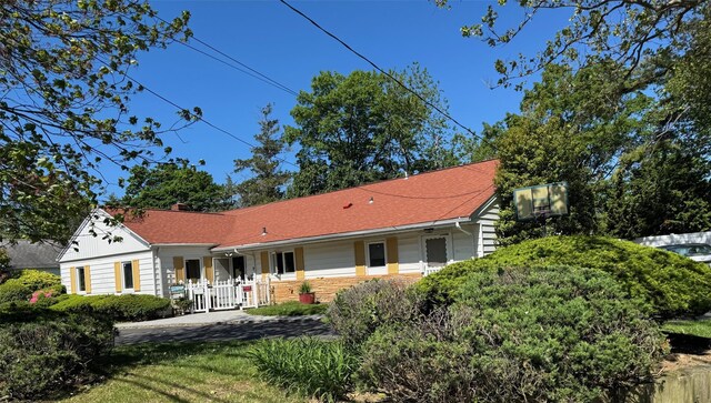 1608 Union Ave Unit 1608, Hewlett, NY 11557 - view of front of house with a chimney and brick siding