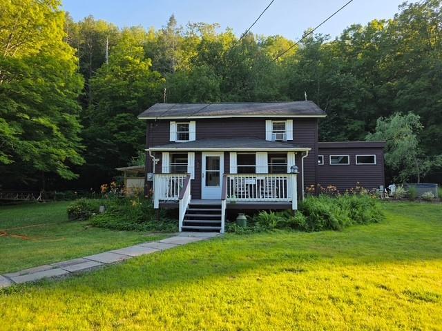 120 Spring Glen Rd, Mountain Dale, NY 12763 - view of front of house with a front lawn and a view of trees