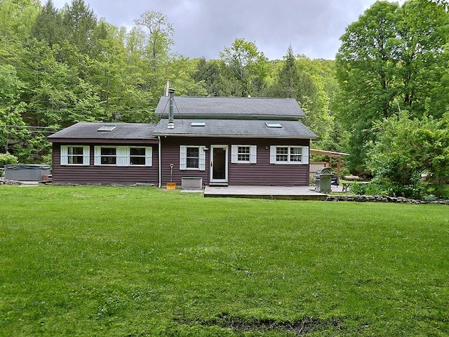 120 Spring Glen Rd, Mountain Dale, NY 12763 - view of front of house featuring a front yard, a wooded view, a hot tub, and a deck