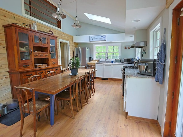 120 Spring Glen Rd, Mountain Dale, NY 12763 - dining area with a skylight, vaulted ceiling, and light wood-style flooring