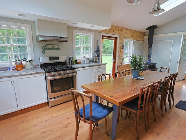120 Spring Glen Rd, Mountain Dale, NY 12763 - dining room with a wood stove, light wood-style floors, and lofted ceiling