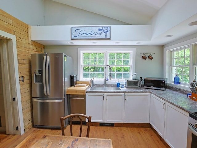 120 Spring Glen Rd, Mountain Dale, NY 12763 - kitchen with appliances with stainless steel finishes, vaulted ceiling, light wood-type flooring, and white cabinetry