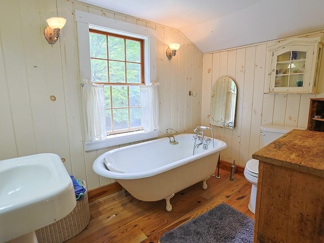 120 Spring Glen Rd, Mountain Dale, NY 12763 - full bath featuring wood-type flooring, a soaking tub, lofted ceiling, and wood walls