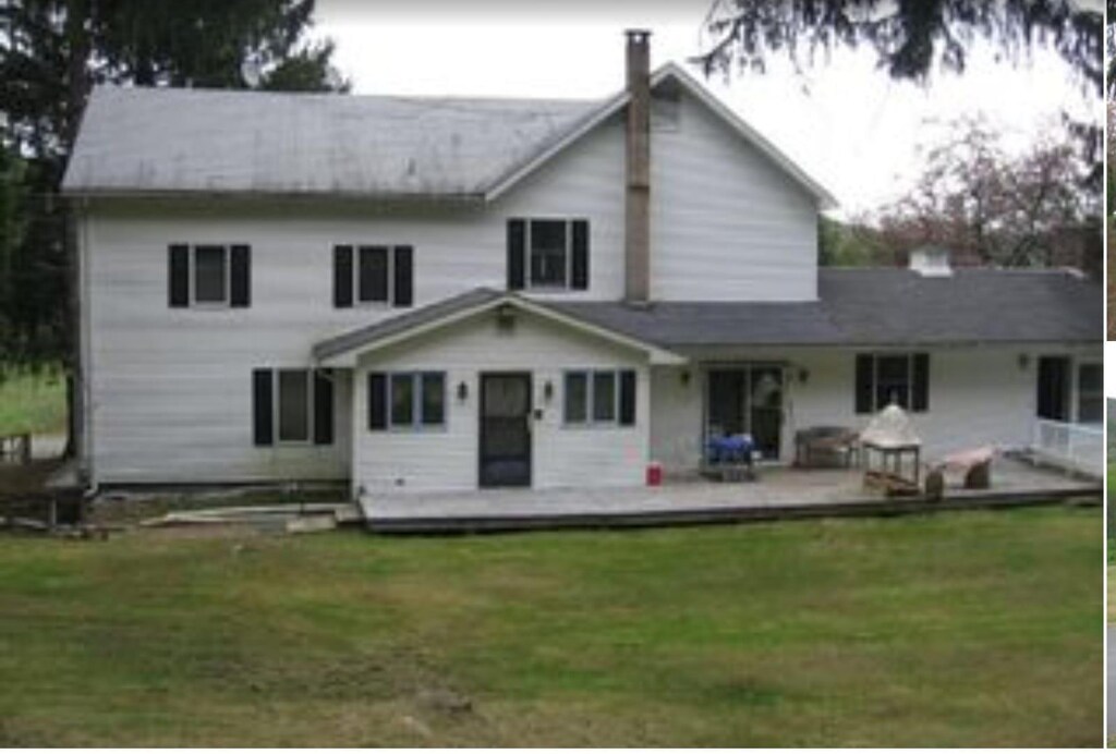 415 Whittaker Rd, South Fallsburg, NY 12779 - rear view of property featuring a yard, a deck, and a chimney