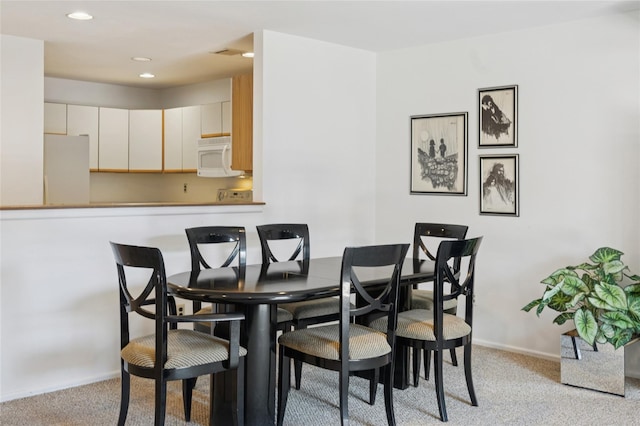 100 Daly Blvd Unit 2605, Oceanside, NY 11572 - dining space with light colored carpet, baseboards, and recessed lighting