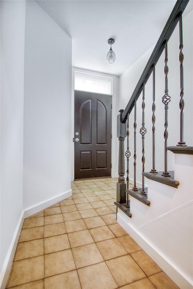 151 Noll St, Brooklyn, NY 11206 - foyer with light tile patterned floors and baseboards