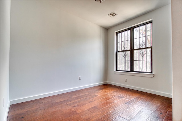 151 Noll St, Brooklyn, NY 11206 - unfurnished room with healthy amount of natural light, wood-type flooring, and baseboards