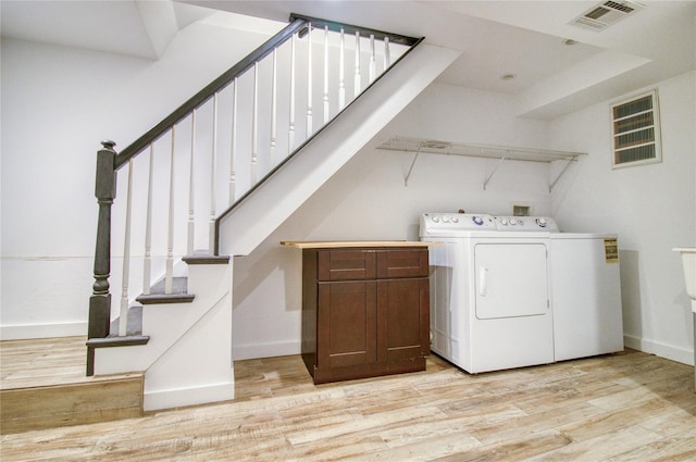 151 Noll St, Brooklyn, NY 11206 - washroom featuring washer and clothes dryer, light wood-style floors, and baseboards