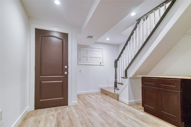 151 Noll St, Brooklyn, NY 11206 - entryway featuring baseboards, light wood-style floors, stairway, and recessed lighting