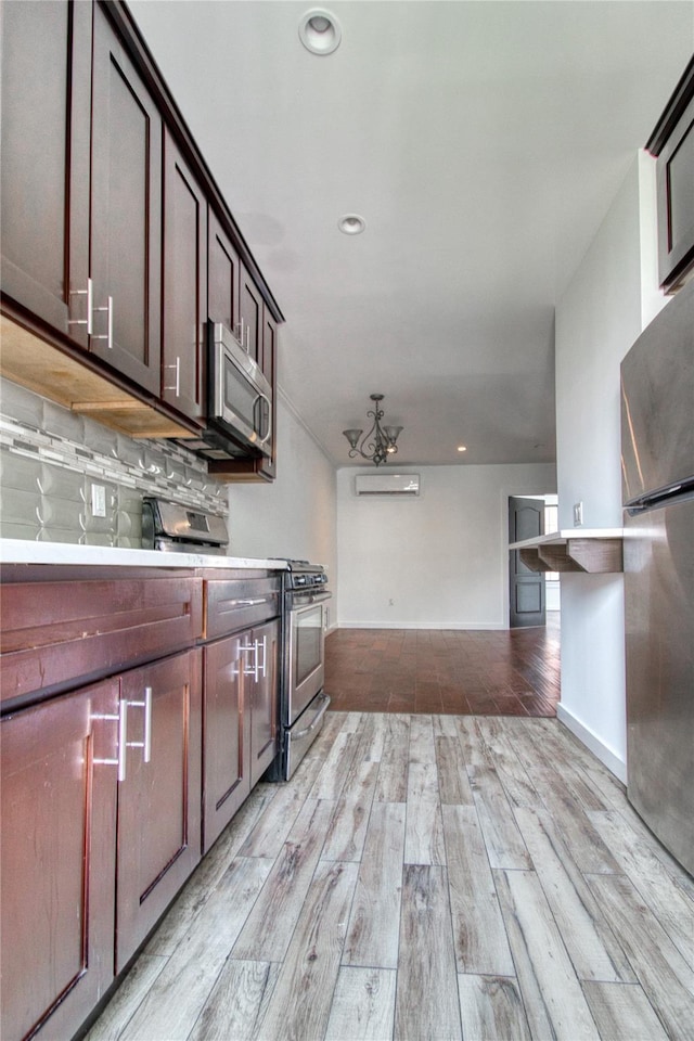 151 Noll St, Brooklyn, NY 11206 - kitchen with stainless steel appliances, light wood-style flooring, light countertops, baseboards, and recessed lighting