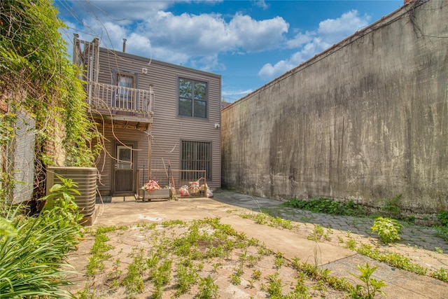 151 Noll St, Brooklyn, NY 11206 - rear view of house with a balcony, a patio area, and central AC