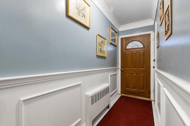 2722 Barnes Ave, Bronx, NY 10467 - doorway featuring radiator, crown molding, wainscoting, and a decorative wall