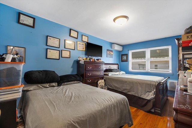2722 Barnes Ave, Bronx, NY 10467 - bedroom featuring wood finished floors and a wall mounted AC