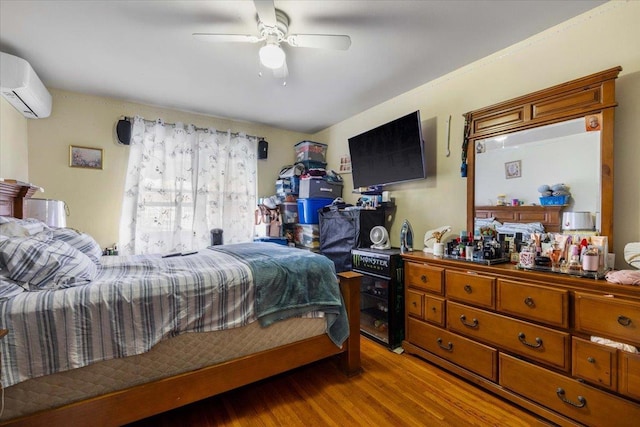 2722 Barnes Ave, Bronx, NY 10467 - bedroom featuring an AC wall unit, wood finished floors, and a ceiling fan