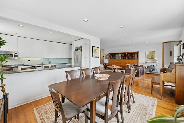 162-41 Powells Cove Blvd Unit 4G, Beechhurst, NY 11357 - dining space featuring recessed lighting and light wood-style floors
