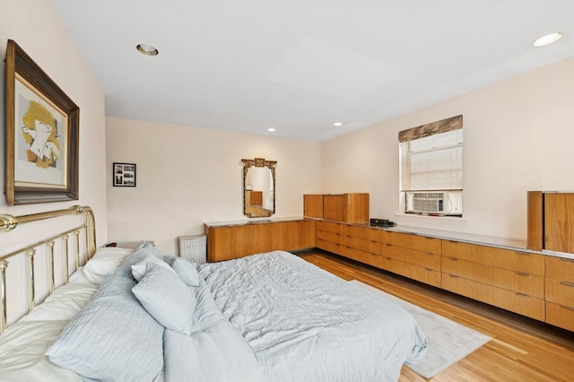 162-41 Powells Cove Blvd Unit 4G, Beechhurst, NY 11357 - bedroom with light wood finished floors, recessed lighting, and cooling unit