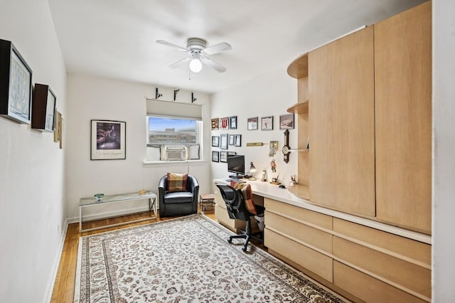 162-41 Powells Cove Blvd Unit 4G, Beechhurst, NY 11357 - office space featuring a ceiling fan, built in study area, wood finished floors, cooling unit, and baseboards