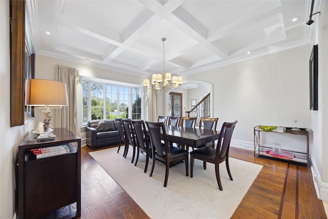 dining area with a chandelier, coffered ceiling, dark wood finished floors, arched walkways, and beamed ceiling