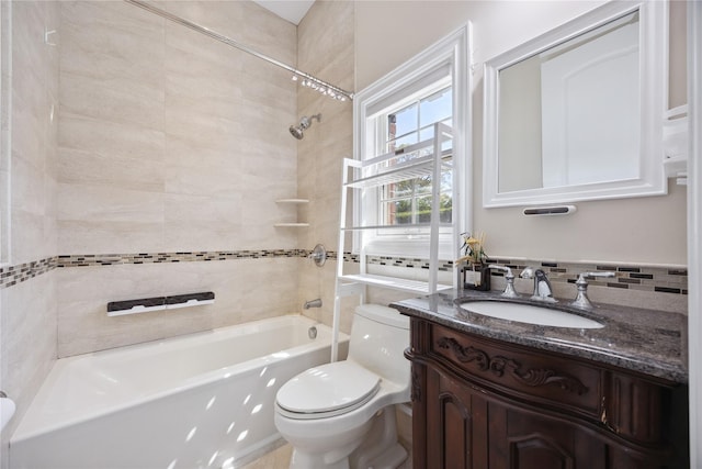 full bathroom with toilet, vanity, and shower / washtub combination