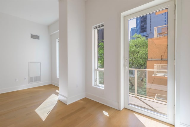 250 E 49th St Unit 5F, New York Manhattan, NY 10017 - entryway with light wood-style floors and baseboards