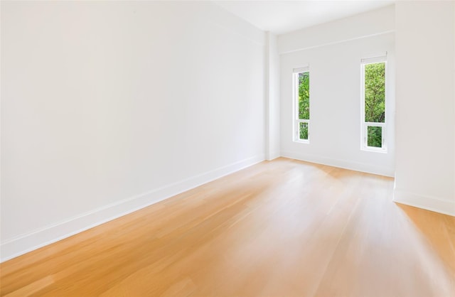 250 E 49th St Unit 5F, New York Manhattan, NY 10017 - empty room featuring light wood-style floors and baseboards