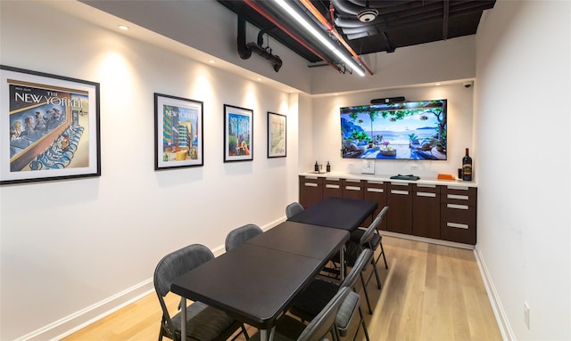 250 E 49th St Unit 5F, New York Manhattan, NY 10017 - home theater featuring light wood-style flooring and baseboards