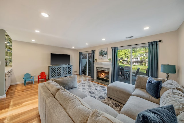 19 Hampshire Ct, Holbrook, NY 11741 - living area featuring recessed lighting, light wood finished floors, baseboards, and a high end fireplace