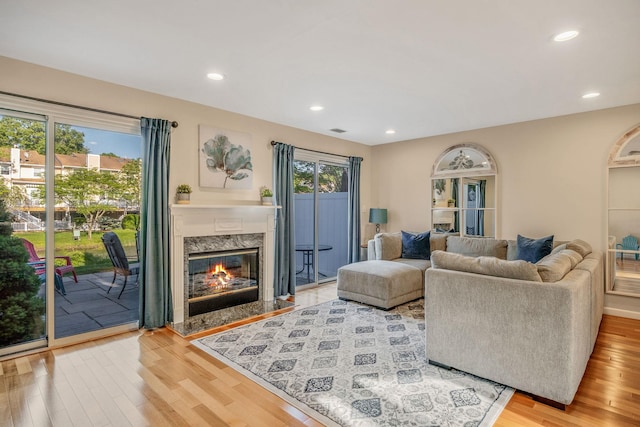 19 Hampshire Ct, Holbrook, NY 11741 - living area featuring wood finished floors, recessed lighting, and a fireplace
