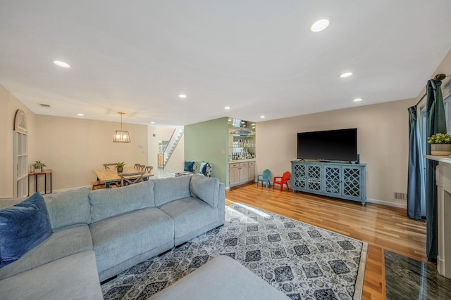 19 Hampshire Ct, Holbrook, NY 11741 - living room with stairway, wood finished floors, recessed lighting, and baseboards
