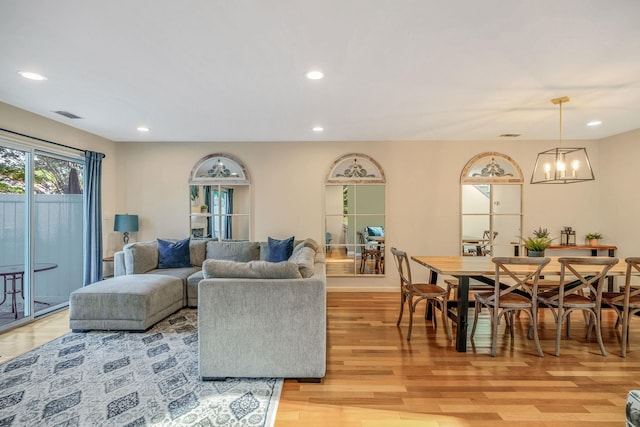 19 Hampshire Ct, Holbrook, NY 11741 - living room with light wood-type flooring, a chandelier, recessed lighting, and baseboards