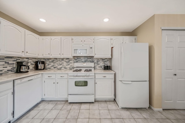 19 Hampshire Ct, Holbrook, NY 11741 - kitchen featuring white appliances, white cabinetry, light countertops, and tasteful backsplash