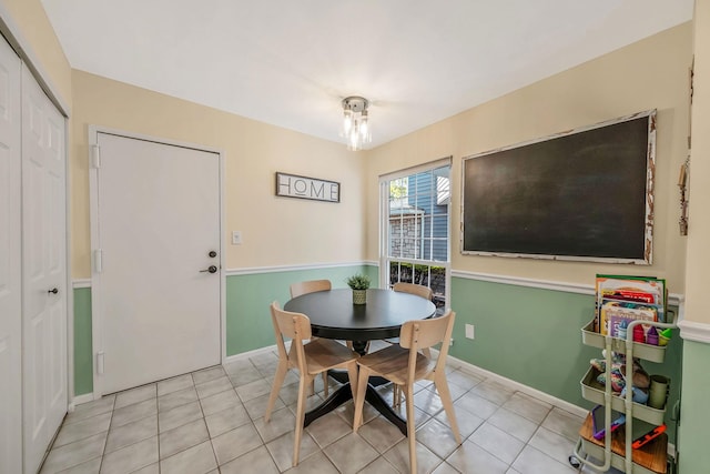 19 Hampshire Ct, Holbrook, NY 11741 - dining room featuring light tile patterned floors and baseboards