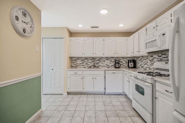 19 Hampshire Ct, Holbrook, NY 11741 - kitchen with white appliances, a sink, decorative backsplash, white cabinetry, and recessed lighting