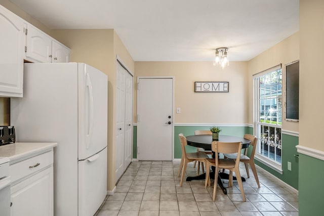 19 Hampshire Ct, Holbrook, NY 11741 - dining space with light tile patterned floors and baseboards